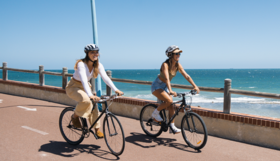 Two people riding bikes