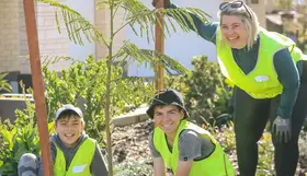 a group of people in yellow vests