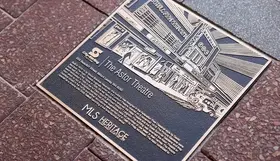 A heritage plaque featuring The Astor Theatre