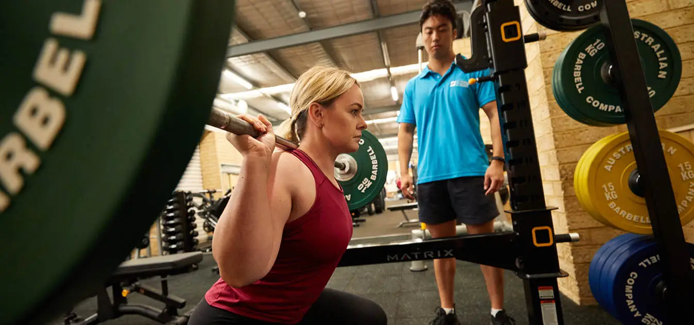 REC_ScarboroughGym_1348x632 A woman lifting a barbell
