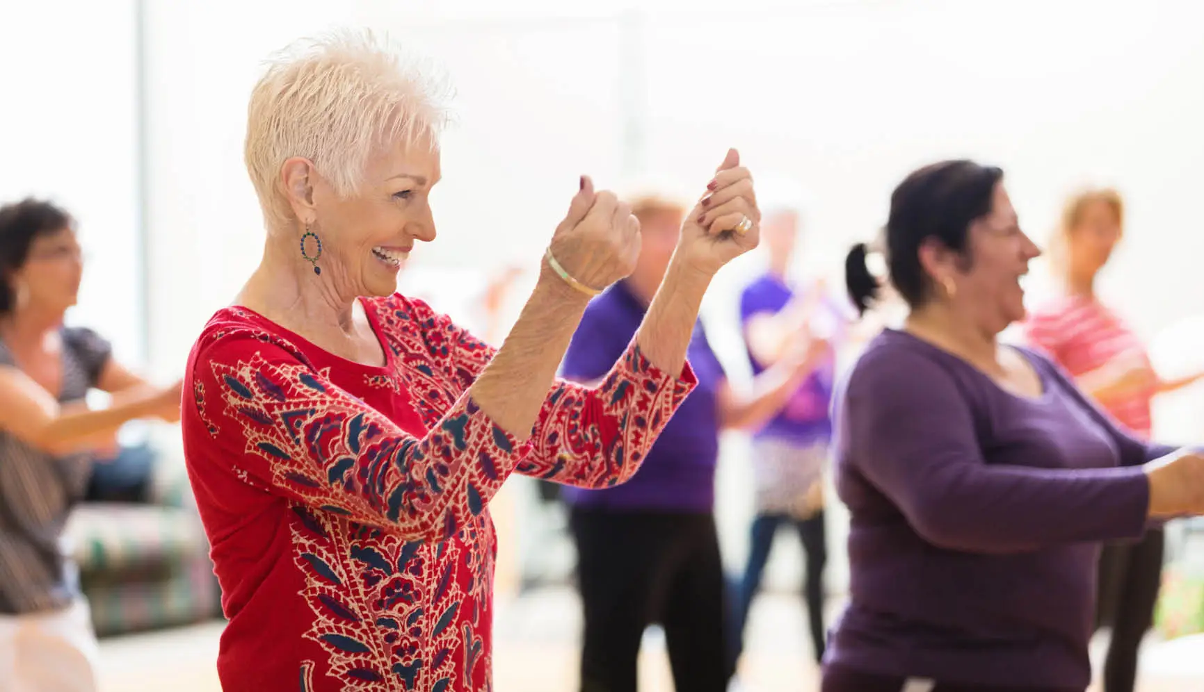 Senior women line dancing together