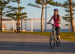 A woman riding a bike on the Scarborough Foreshore