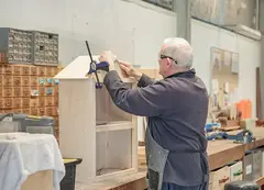 A man crafting an object