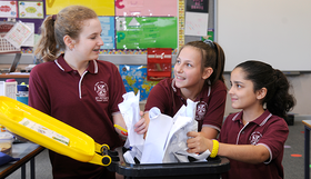 Kids recycling paper