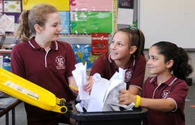 Kids recycling paper