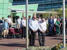 Members of the Jewish community with heads bowed