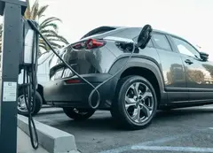 An electric vehicle being charged