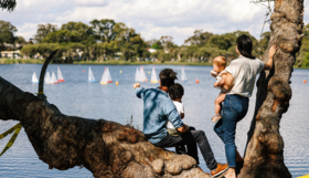 A family watching boats