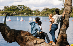 A family watching boats