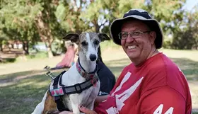 a man holding a dog