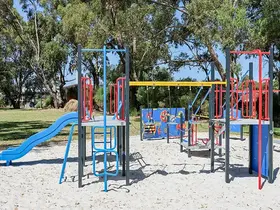 a playground with a slide and play equipment
