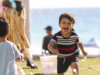 Image of children running in bubbles in Scarborough