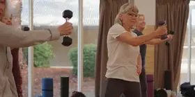 A group of women lifting weights