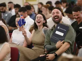 New citizens smiling