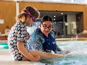 A child kicks in a pool