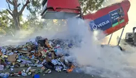 Burning waste dumped from a rubbish truck