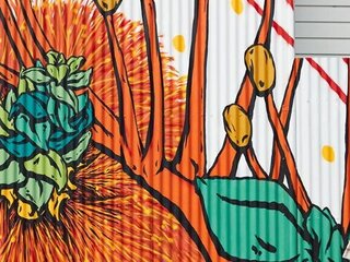 A large mural of natuve plants