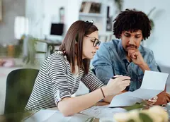 A couple reviewing bills