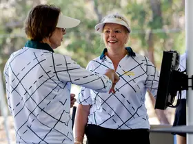 Two golfers at the driving range