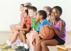 A group of children in sporting clothes