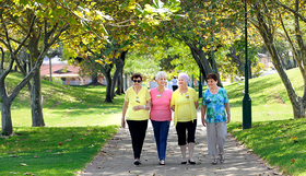 Four women walking together