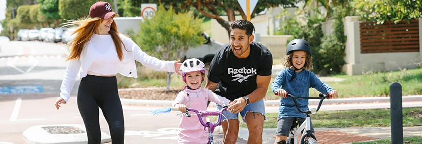 A family of four on a bike ride