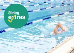 A person swimming with 'Stirling Extras' on the image