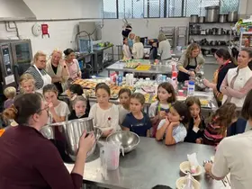 Children watching a demonstration in The Kitchen