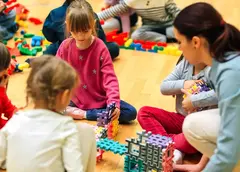 a group of children playing with blocks