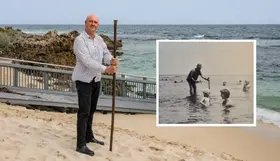 Todd Mettam holding a crowbar