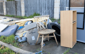 A pile of discarded rubbish and furniture