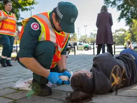 A paramedic treating a 'casualty'