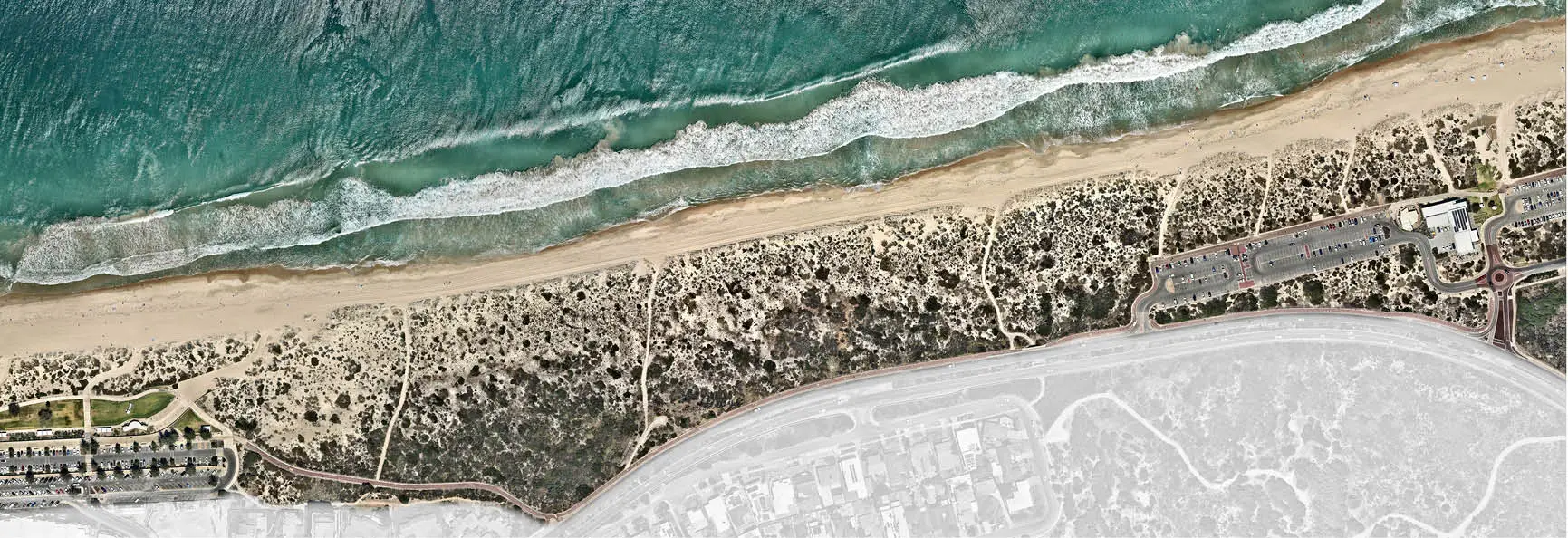 a beach with sand and water
