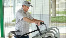 A man holding a bike