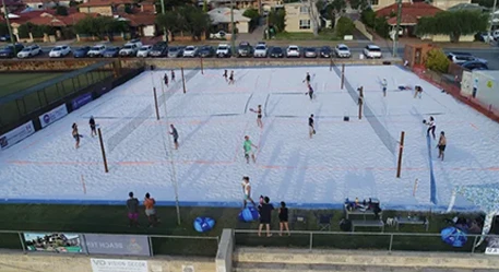 a group of people playing volleyball
