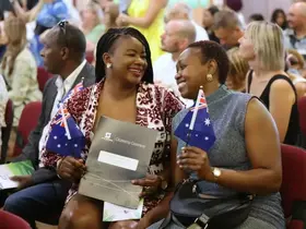 New citizens holding Australian flags
