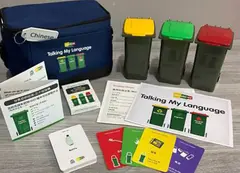 a group of trash cans and cards