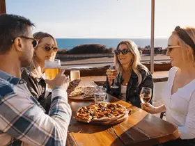 A group of friends dining at Froth Cafe Bar