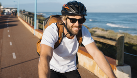 A man on a bicycle on a shared path