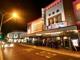 A queue waiting for a show at the Astor Theatre
