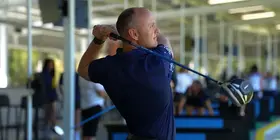 A golfer at the driving range