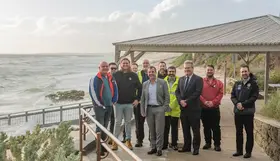 a group of people standing on a deck