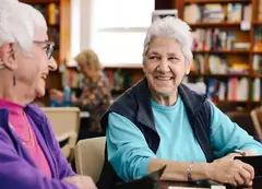 Two older people talking