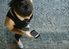 A woman using the Stirling Leisure app