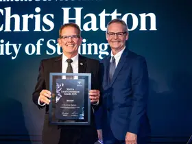 Cr Chris Hatton receives his Merit Award