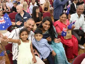 New citizens waving flags