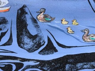 a painting of ducks swimming in a river