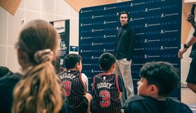 Josh Giddey speaking to a crowd