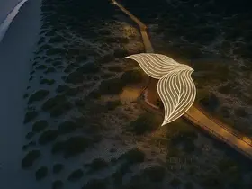 a light sculpture on a path