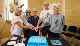 Friends of Star Swamp Bushland cutting a cake